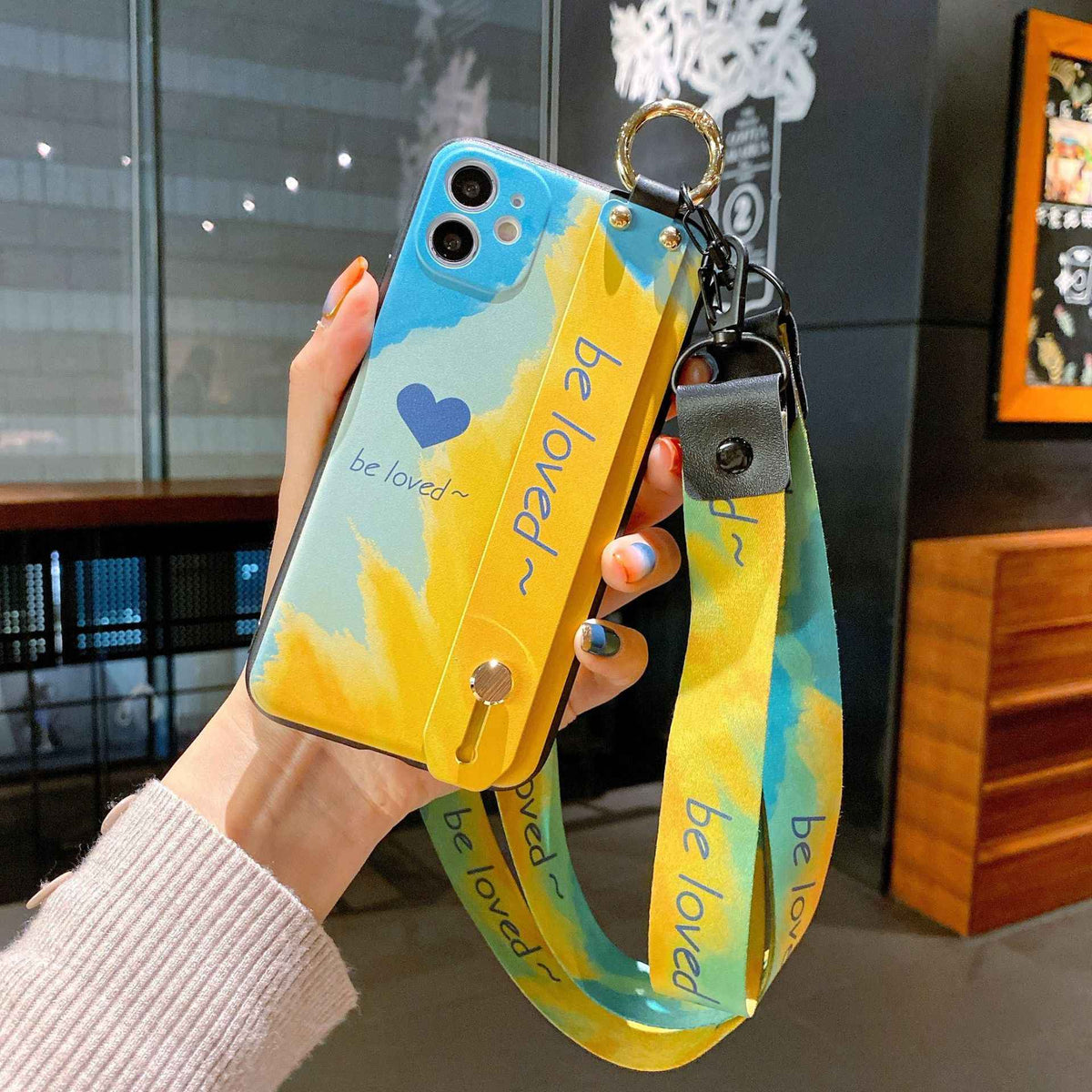 Camouflage Graffiti iPhone Case with Wristband – TPU+PC Fashion Back Cover, iPhone 7 to 12 Pro Max (3 Colors)